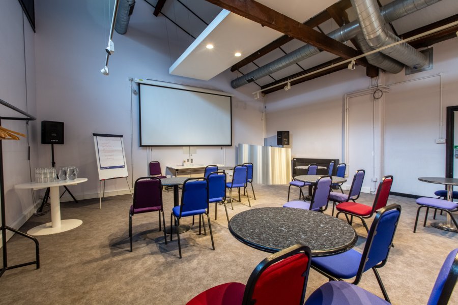 A view of Watershed 2 space with cabaret style setup