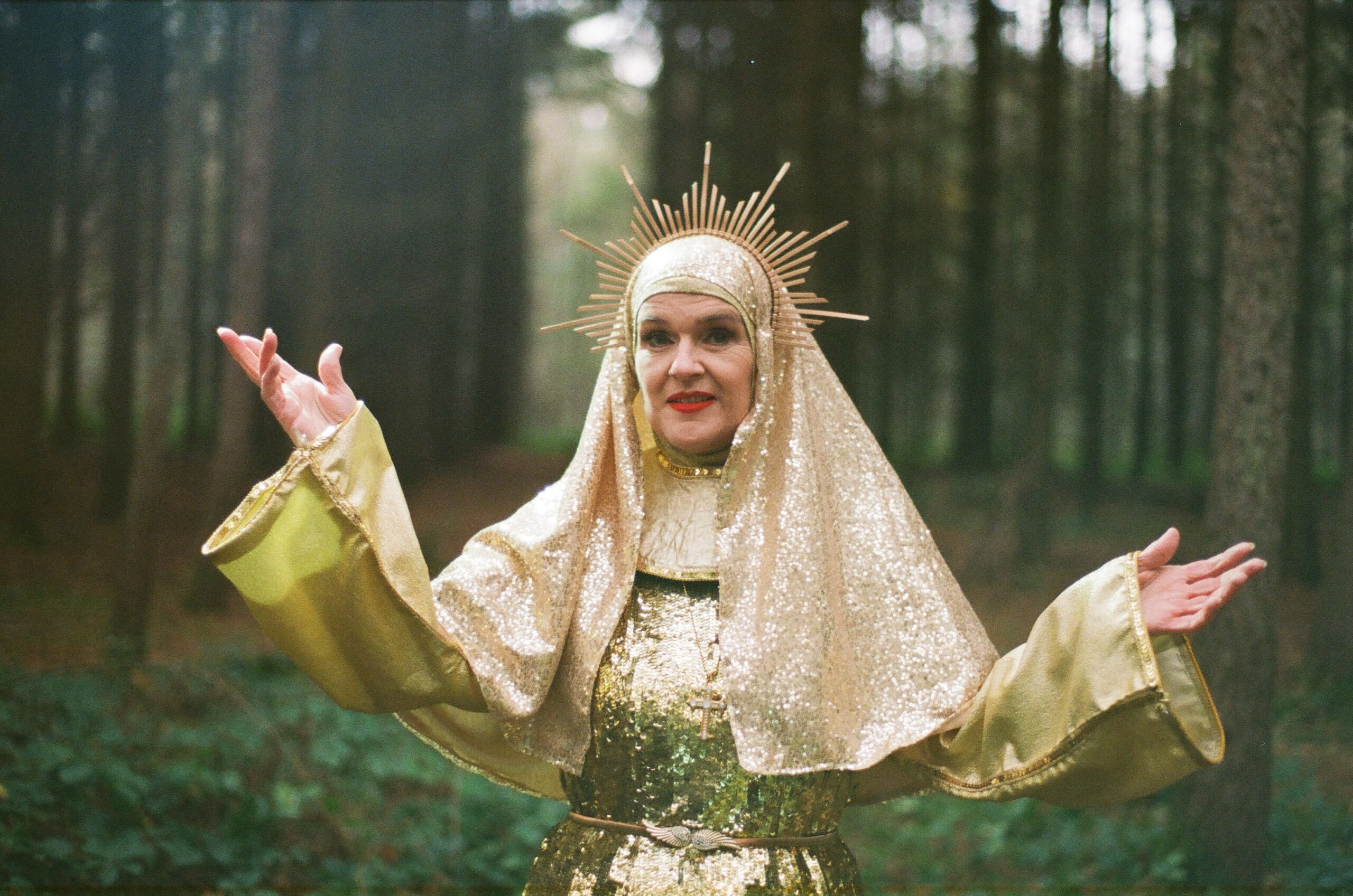 a nun dressed in a golden glitter habit