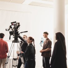 Young people working on a film set.