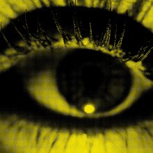 A close up of an eye under a yellow and black filter