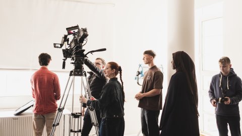 Young people working on a film set.