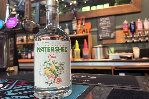 A bottle of Watershed Gin presented on the bar in the Café & Bar.